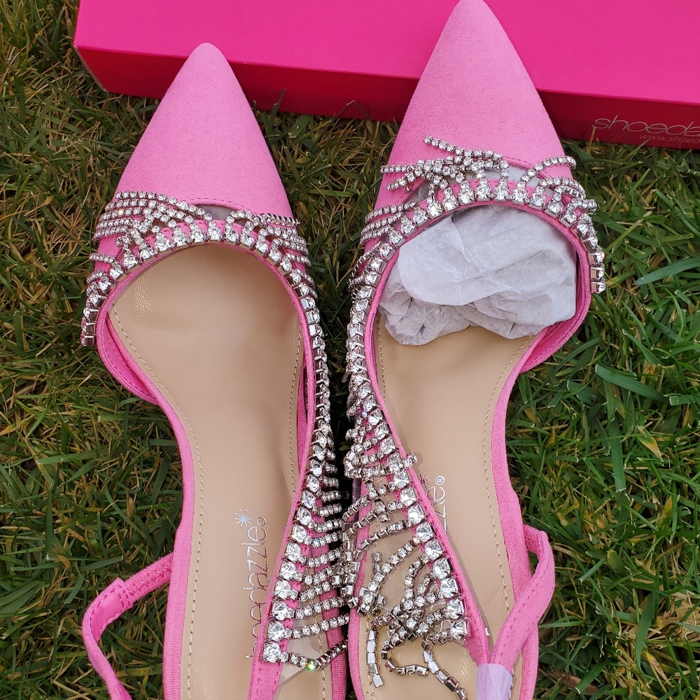 A pink slingback stiletto pump with fringe trim